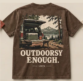 Outdoorsy Enough tee: an SUV with its tailgate open at a lakeside camp, on brown.